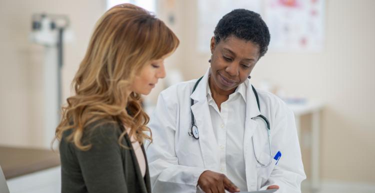 A woman talking to a doctor