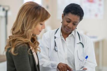 A woman talking to a doctor