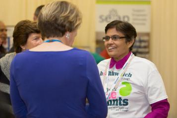 Healthwatch volunteer talking to a member of the public