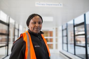 Lady standing in a hospital