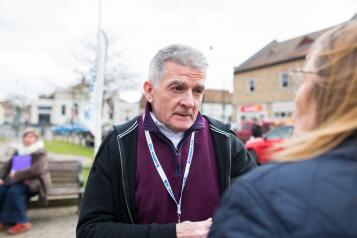 Male Healthwatch volunteer at a community event