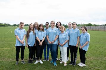 Group of young volunteers smiling at the camera