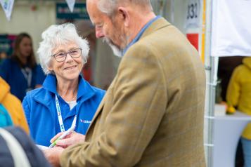 Healthwatch volunteer talking to a man