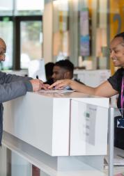 Patient speaking to a receptionist