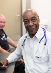 Male doctor speaking to a patient 