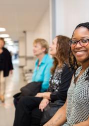 Woman smiling waiting in a hospital 